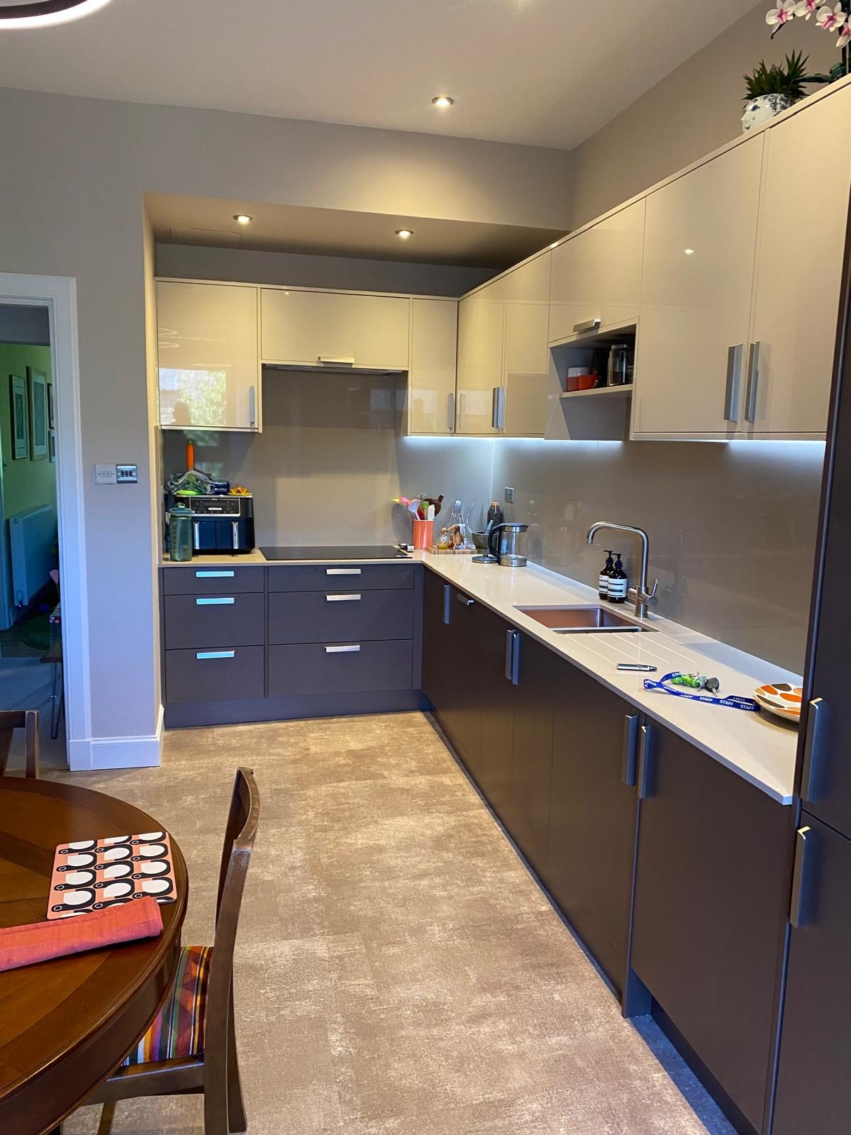 Navy blue kitchen units with wood-effect worktops