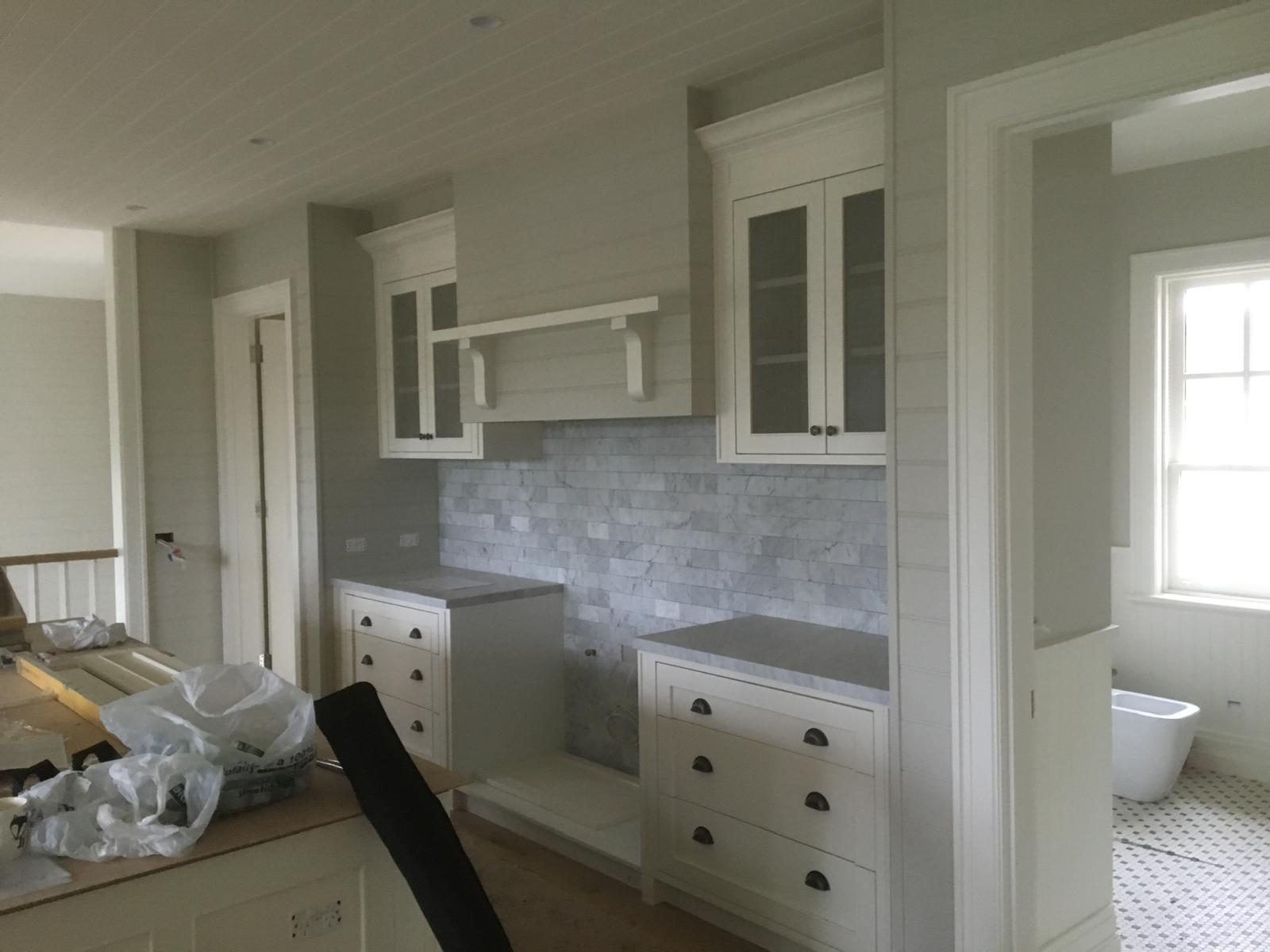 White shaker kitchen with a central island