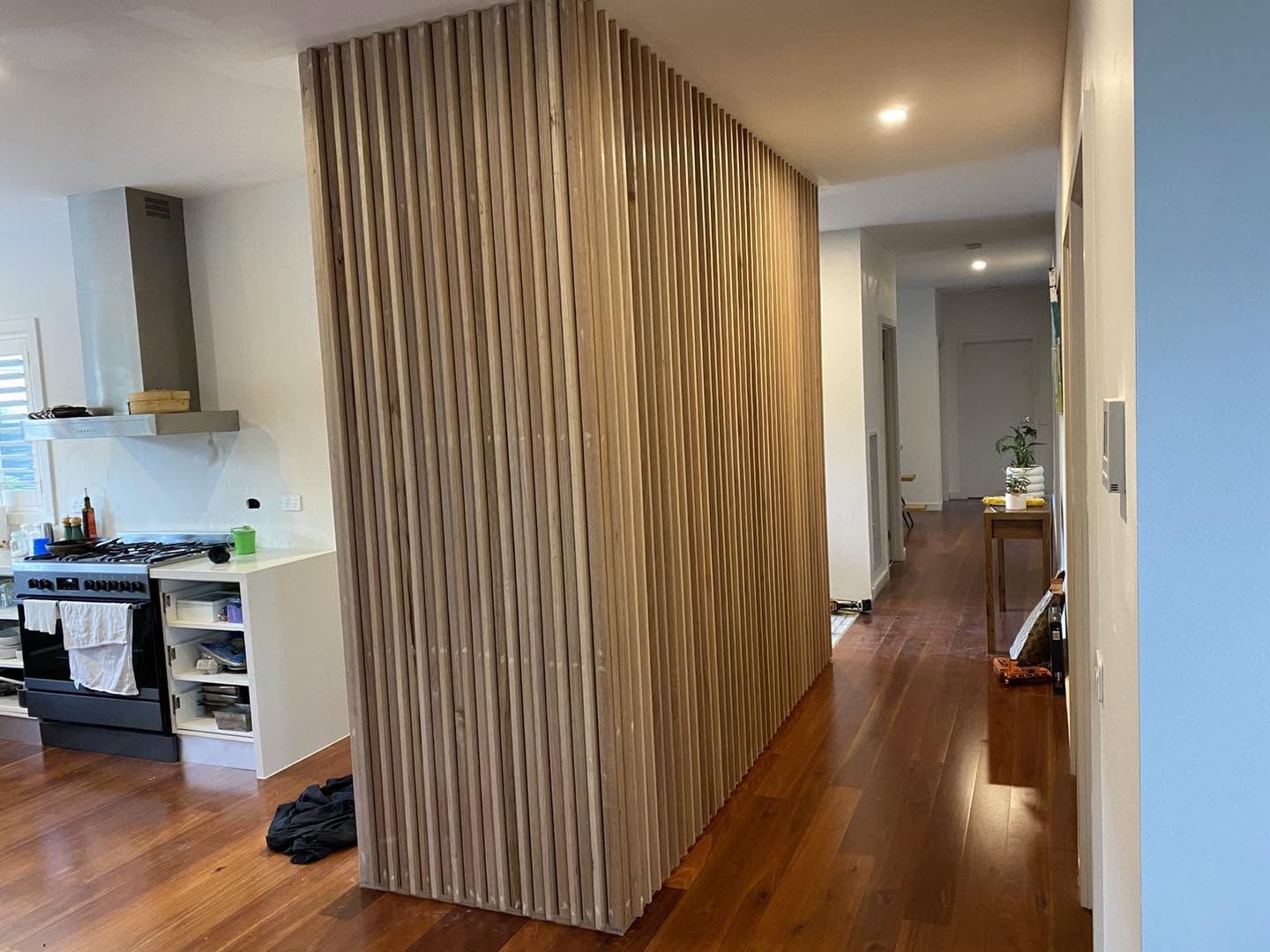 Oak slatted feature wall inside a home